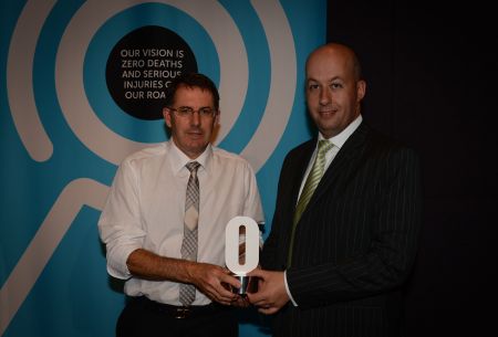A VicRoads representative accepts the Safe Roads award 